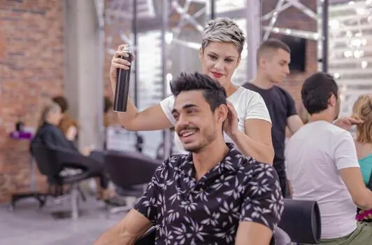 professional-hairdresser-is-cutting-men-s-hair-in-beauty-salon-photo
